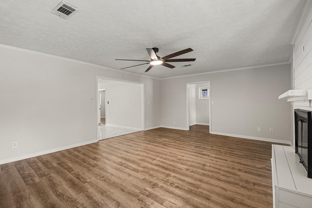 2312 Burnside Drive Columbus, GA 31907 - Photo 4 of 25 a view of an empty room with a ceiling fan