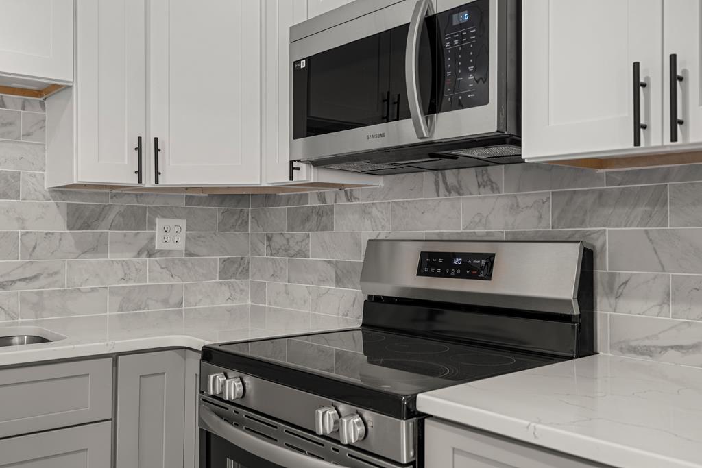 2312 Burnside Drive Columbus, GA 31907 - Photo 9 of 25 a kitchen with a stove and a microwave