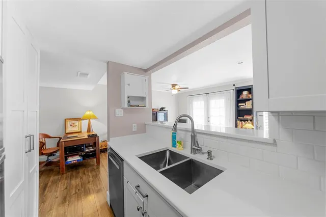 a kitchen with a sink and refrigerator