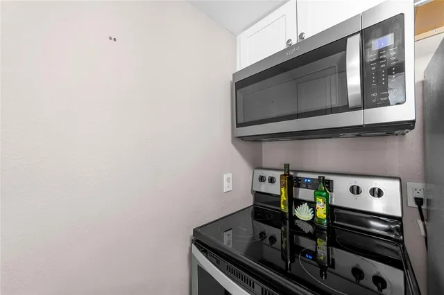 a bathroom with a sink mirror and toilet