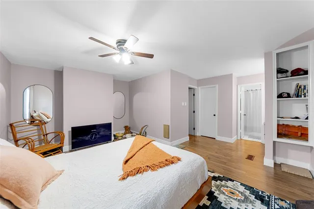 a bed room with a bed and a chandelier