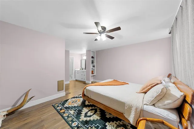 a bathroom with a double vanity sink a mirror and a shower