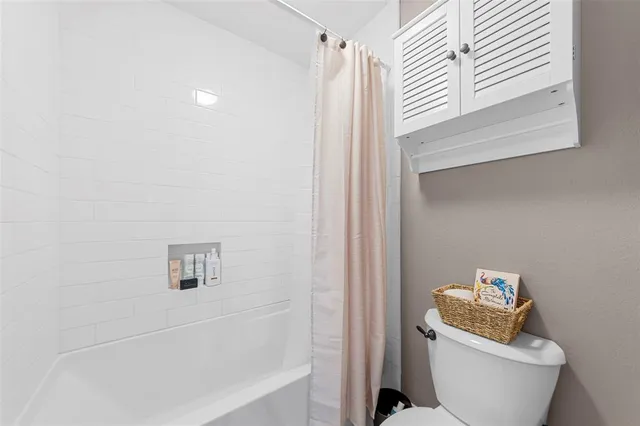 a view of a balcony with wooden fence