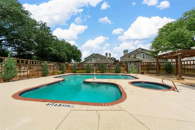 a view of a car parked in front of house