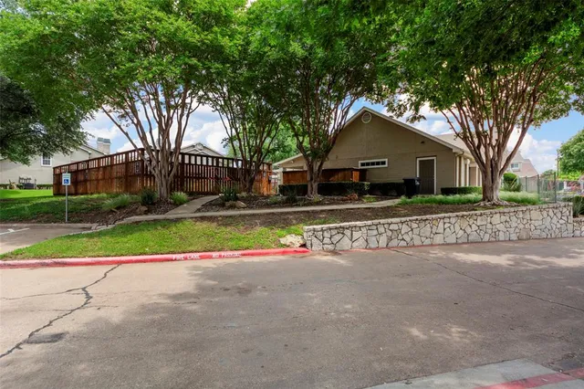 a view of a car parked in front of house