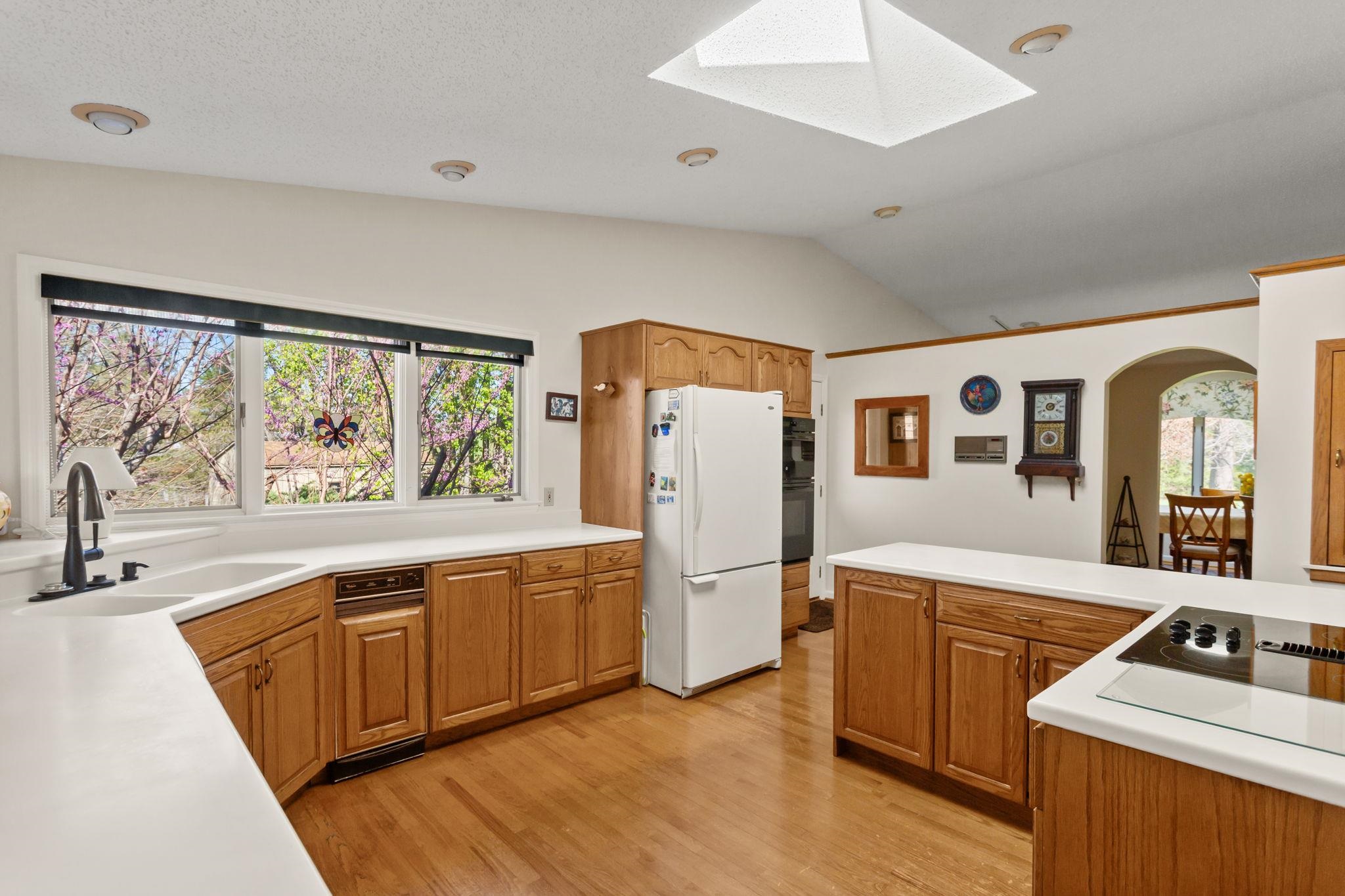 13004 Indian Trail Road Broadway, VA 22815 - Photo 13 of 56 is amazing with range top on island, archway pass through to dining room.