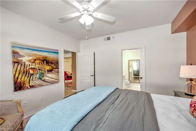 a bedroom with furniture and a chandelier