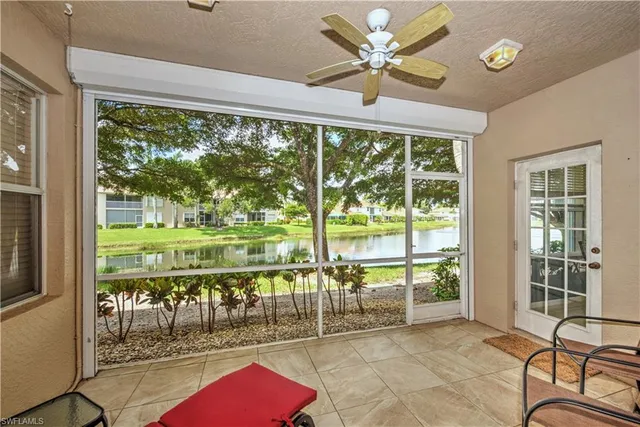 a living room with hardwood floor and balcony view