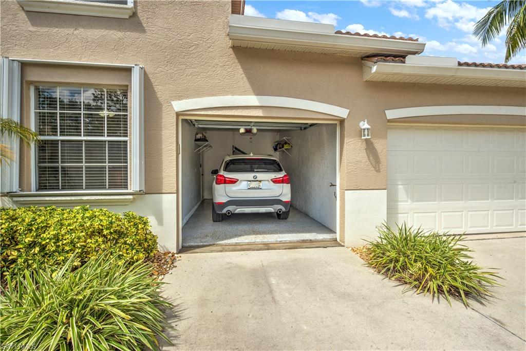 343 Dover Place, Unit A104 Naples, FL 34104 - Photo 7 of 36 a view of a entryway door of the house