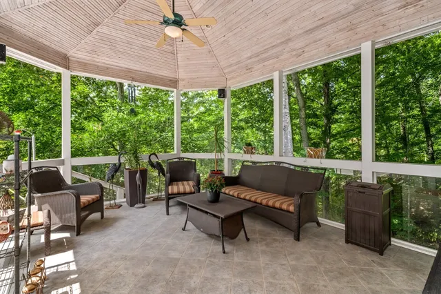 a view of a patio with table and chairs
