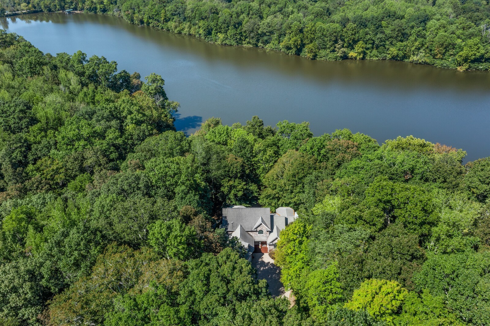 415 Cooksey Batson Road Charlotte, TN 37036 - Photo 2 of 60 an aerial view of a houses with a lake view