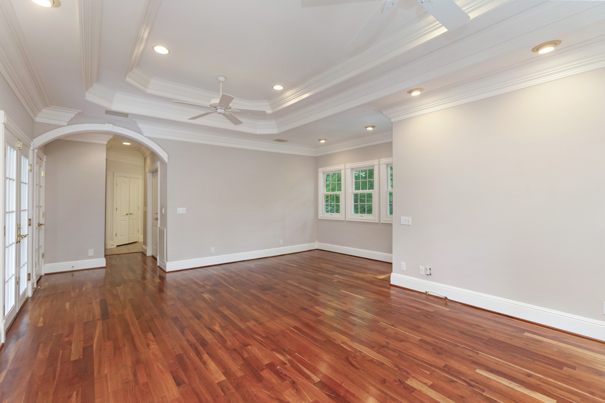 415 Cooksey Batson Road Charlotte, TN 37036 - Photo 25 of 60 an empty room with wooden floor and windows