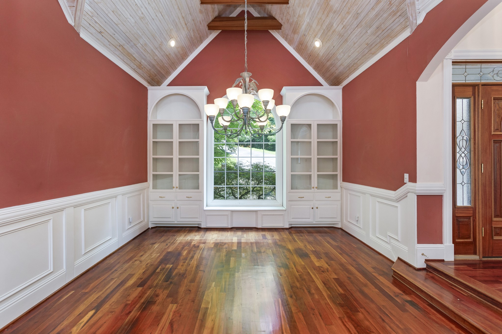 415 Cooksey Batson Road Charlotte, TN 37036 - Photo 7 of 60 a view of an empty room with wooden floor and a window