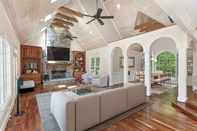 a living room with fireplace furniture and a flat screen tv