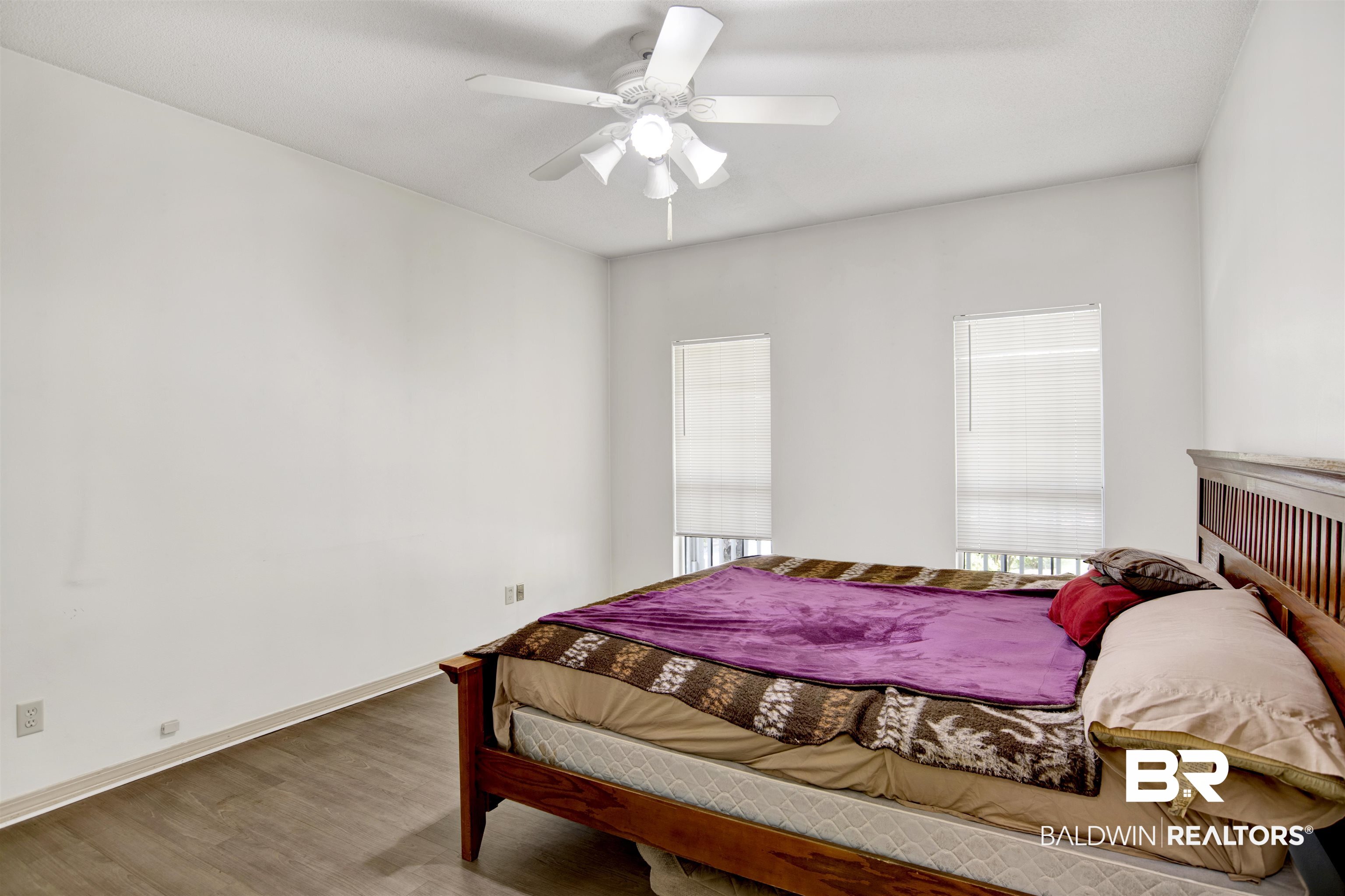 3412 Peyton Court Mobile, AL 36695 - Photo 16 of 27 Bedroom featuring wood finished floors, ceiling fan, and baseboards