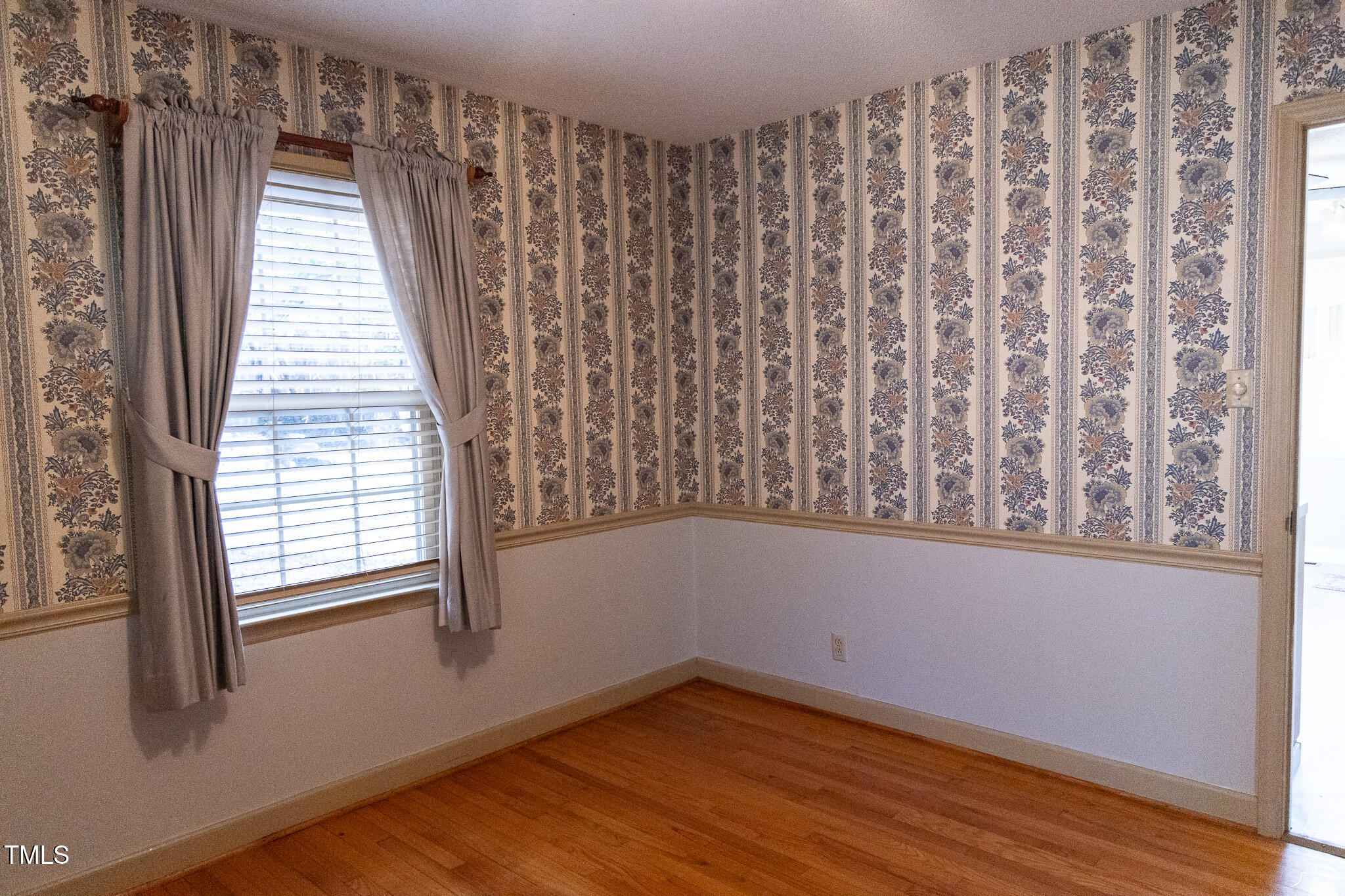 3212 Sparger Road Durham, NC 27705 - Photo 12 of 57 a view of a small space with wooden floor and a window