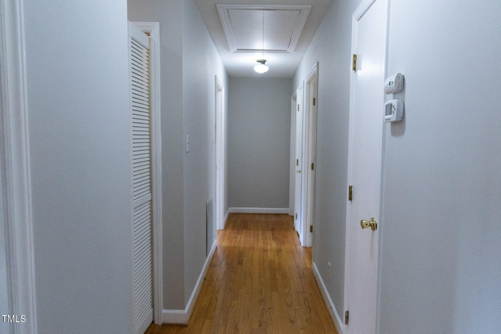 3212 Sparger Road Durham, NC 27705 - Photo 18 of 57 a view of a hallway with wooden floor