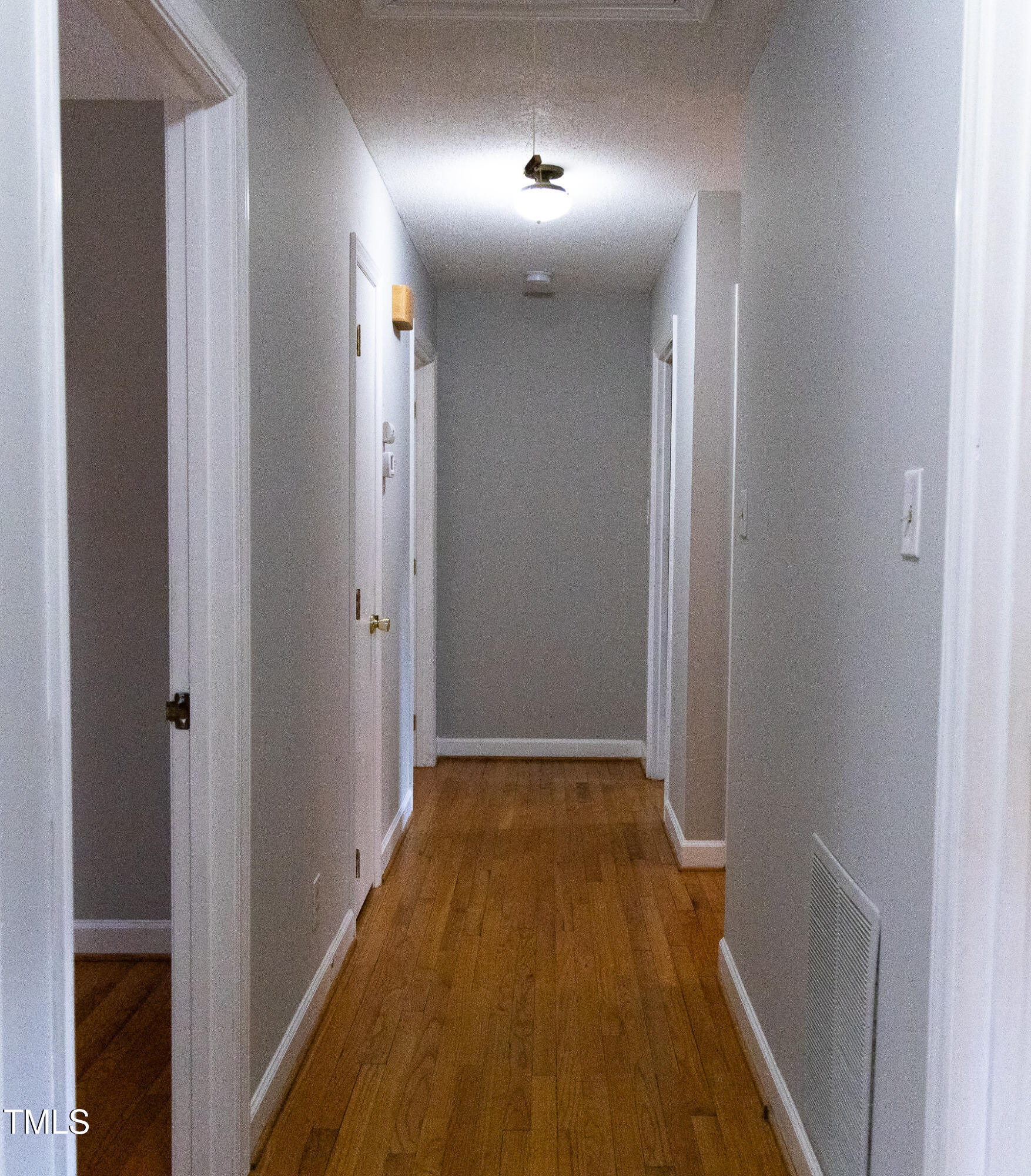 3212 Sparger Road Durham, NC 27705 - Photo 25 of 57 a view of hallway with wooden floor