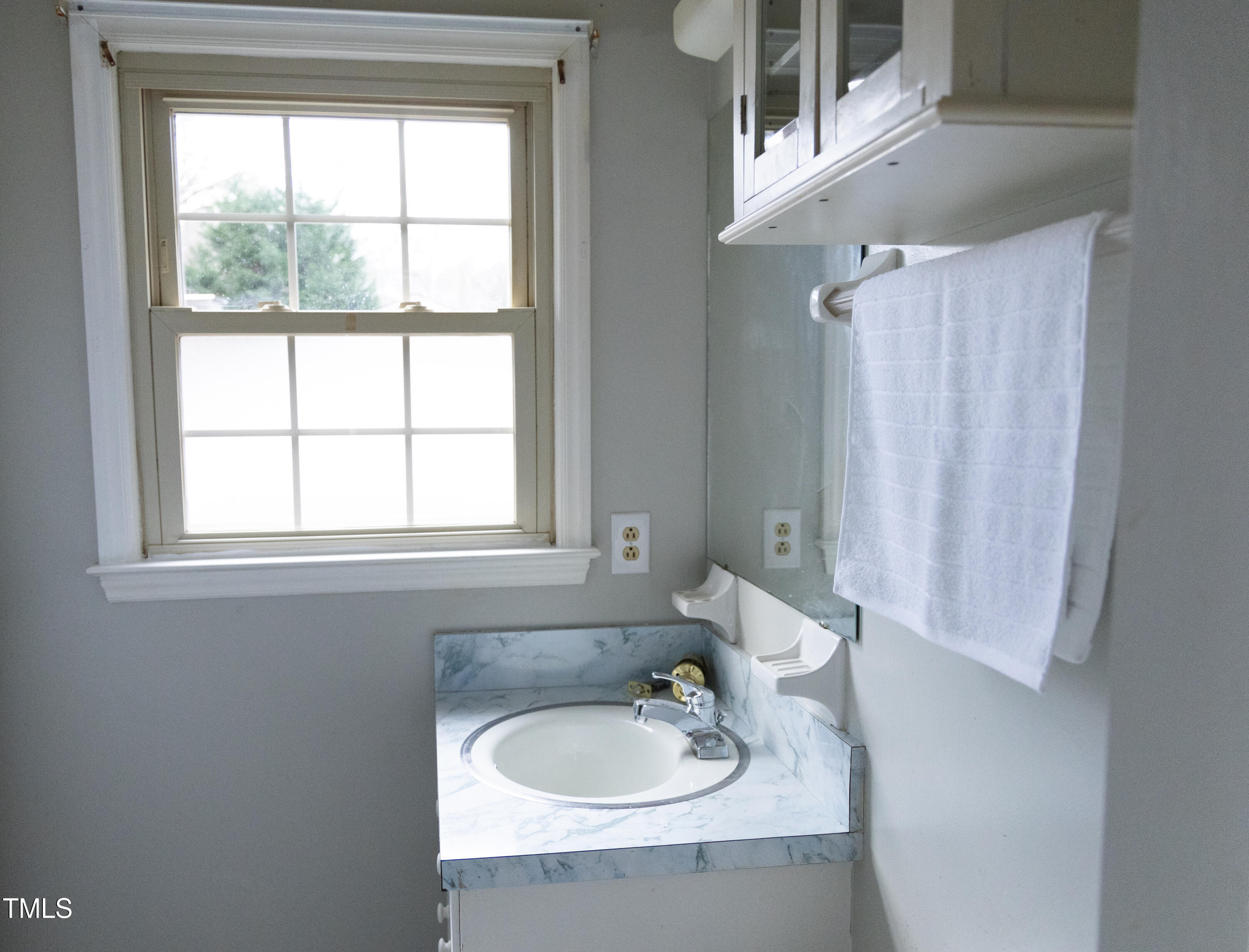 3212 Sparger Road Durham, NC 27705 - Photo 26 of 57 a bathroom with a sink and a mirror