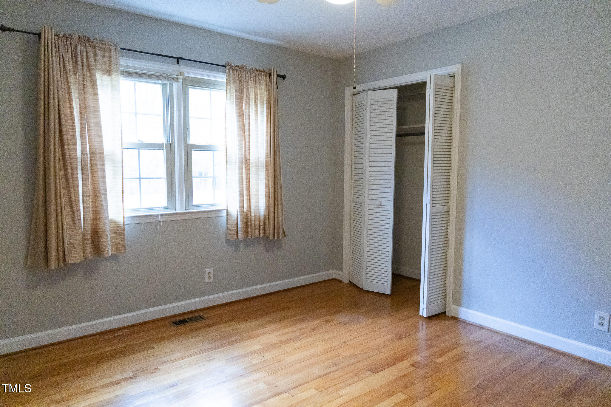 3212 Sparger Road Durham, NC 27705 - Photo 33 of 57 an empty room with wooden floor and windows