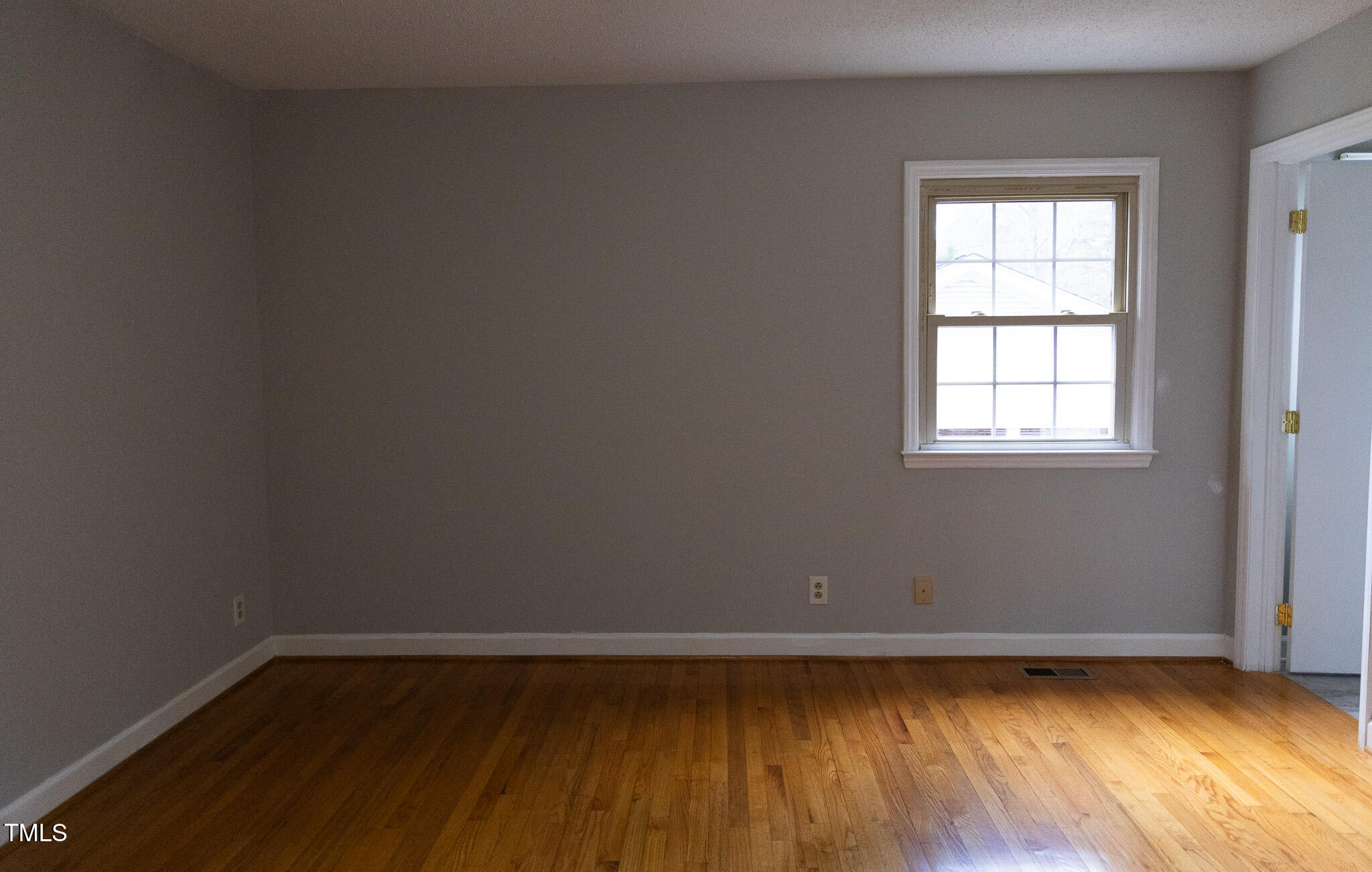 3212 Sparger Road Durham, NC 27705 - Photo 37 of 57 a view of a room with wooden floors and window