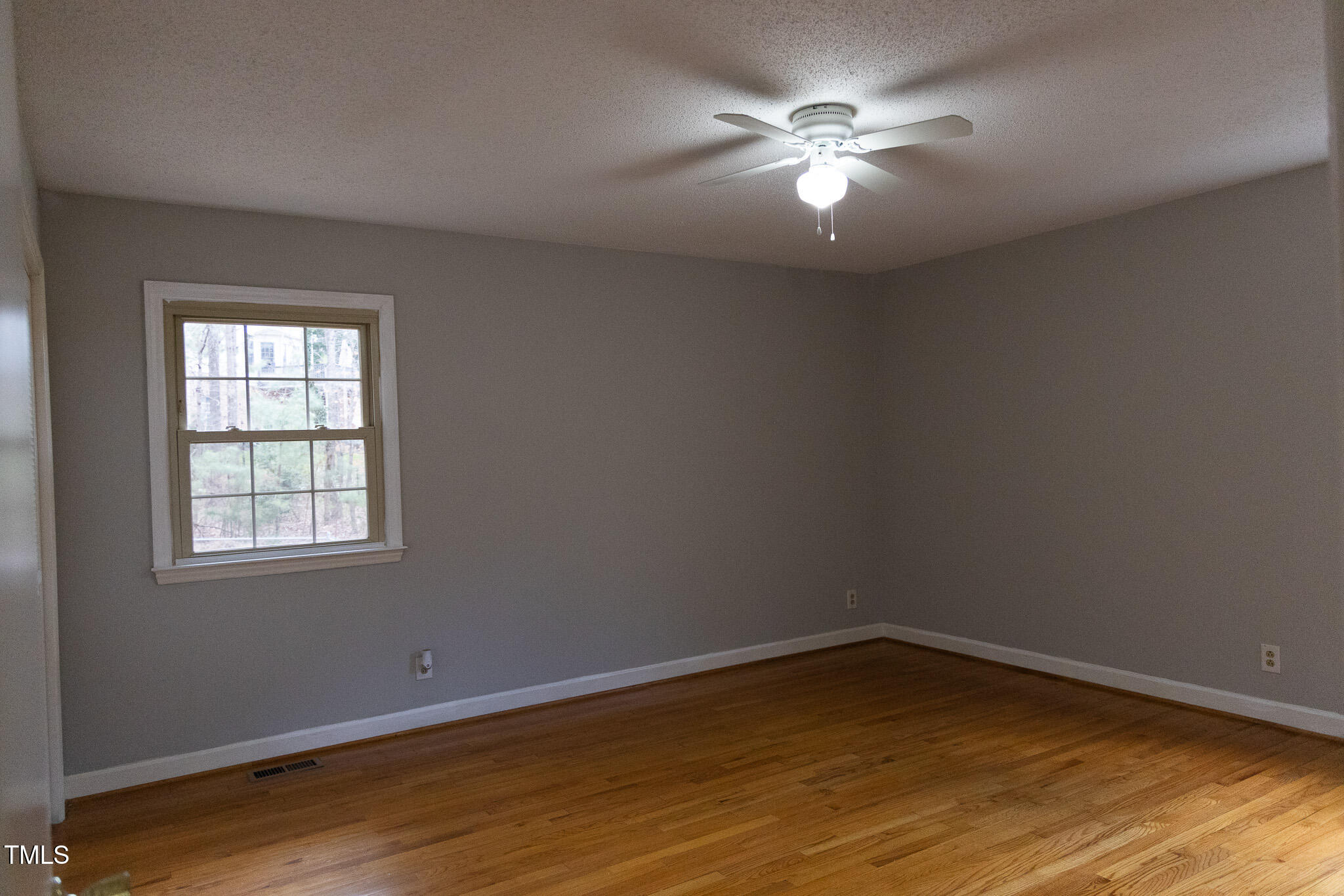 3212 Sparger Road Durham, NC 27705 - Photo 41 of 57 an empty room with wooden floor and windows