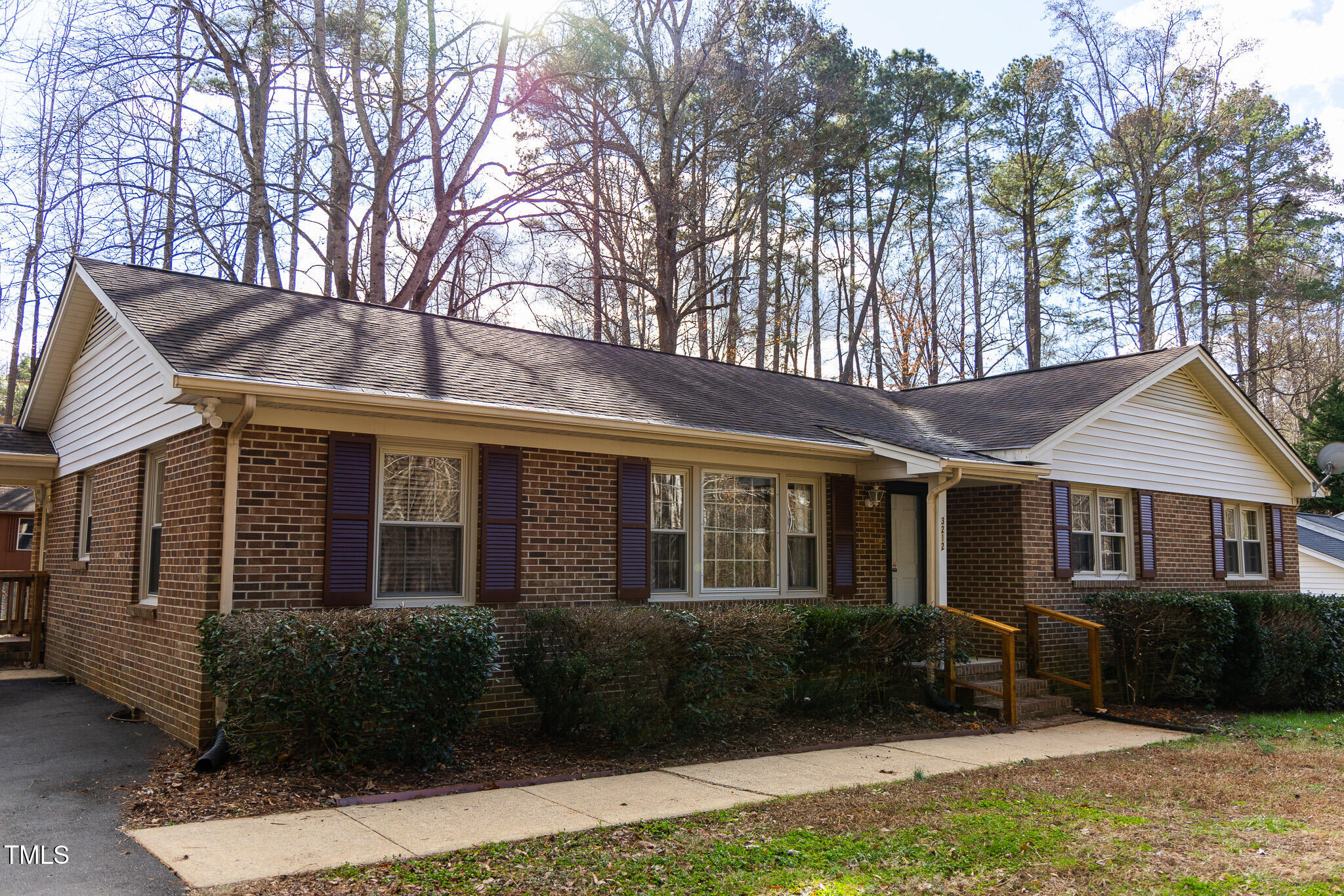 3212 Sparger Road Durham, NC 27705 - Photo 54 of 57 a front view of a house with yard and green space