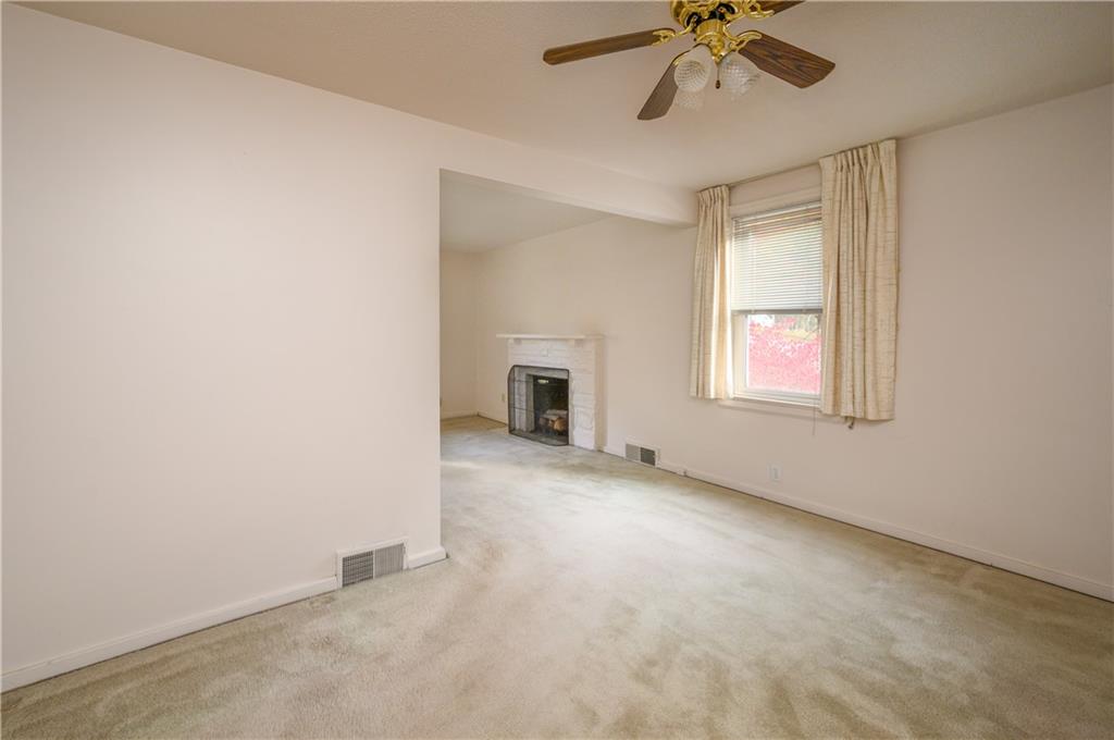 501 Sangree Road Pittsburgh, PA 15237 - Photo 6 of 29 an empty room with a window and a ceiling fan