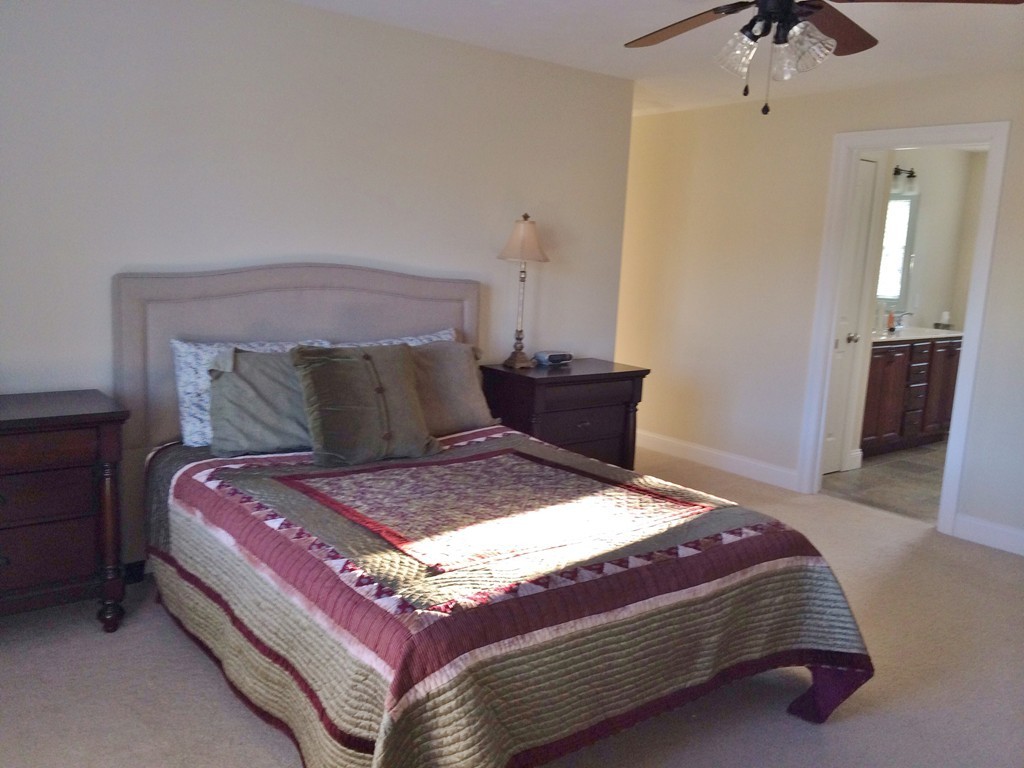 14 Carlson's Way Rutland, MA 01543 - Photo 13 of 20 a bedroom with a bed and a chandelier