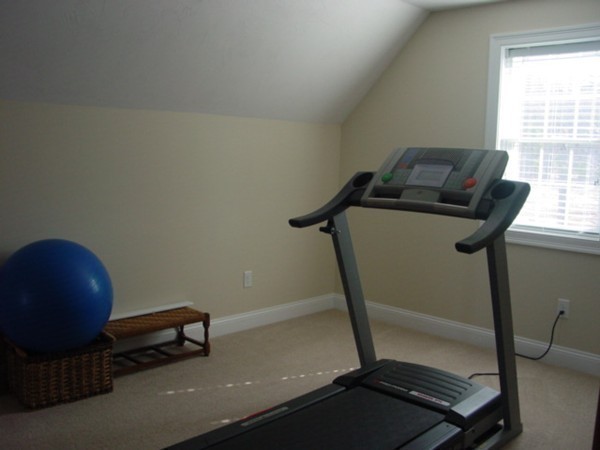 14 Carlson's Way Rutland, MA 01543 - Photo 16 of 20 a room with gym equipment and windows