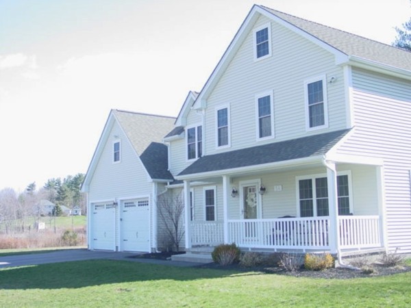 14 Carlson's Way Rutland, MA 01543 - Photo 2 of 20 a front view of a house with a garden