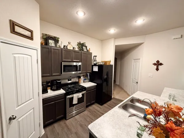 a bedroom with a bed and a television