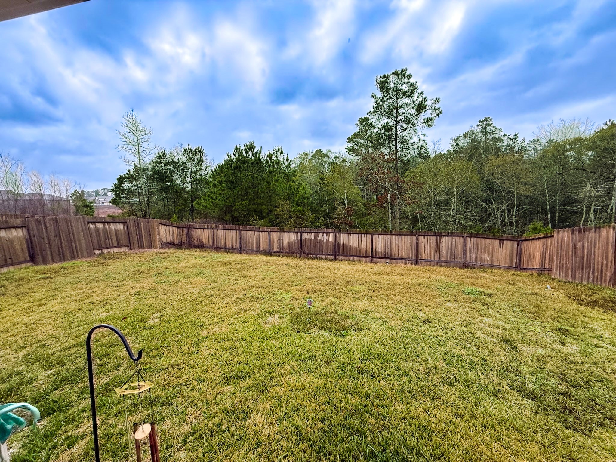 13979 Katlin Road Conroe, TX 77306 - Photo 12 of 13 a swimming pool with wooden fence