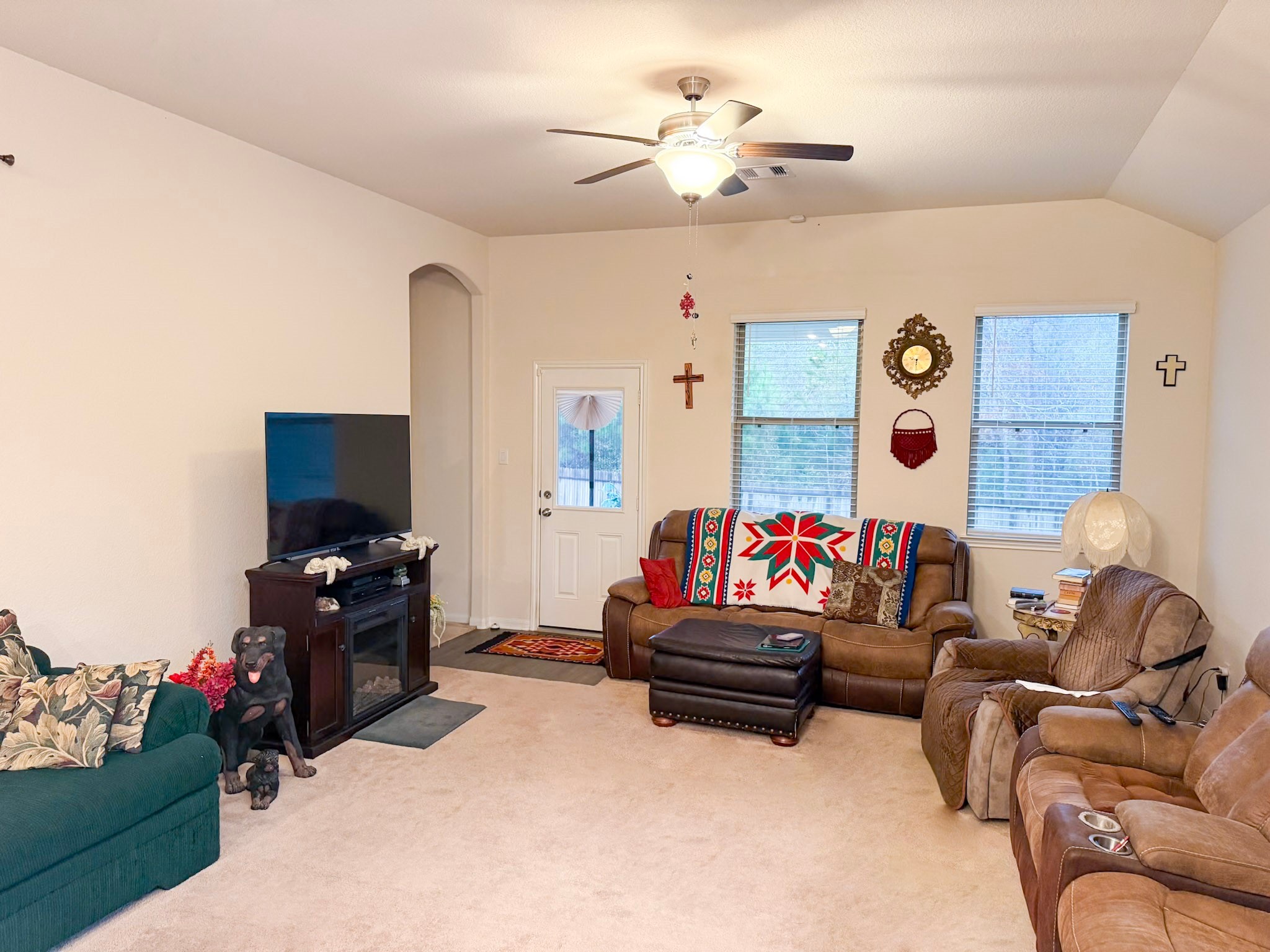 13979 Katlin Road Conroe, TX 77306 - Photo 5 of 13 a living room with furniture and a flat screen tv