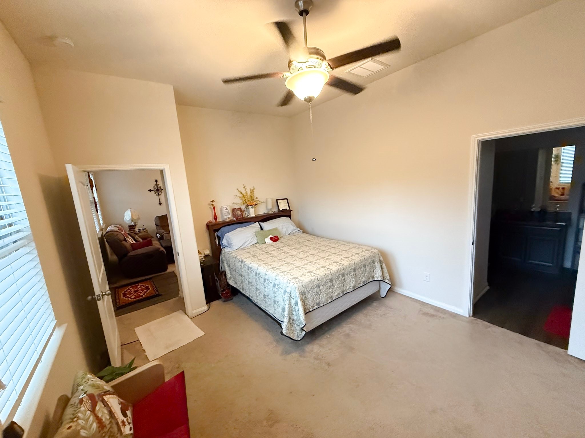 13979 Katlin Road Conroe, TX 77306 - Photo 7 of 13 a bedroom with a bed and a mirror