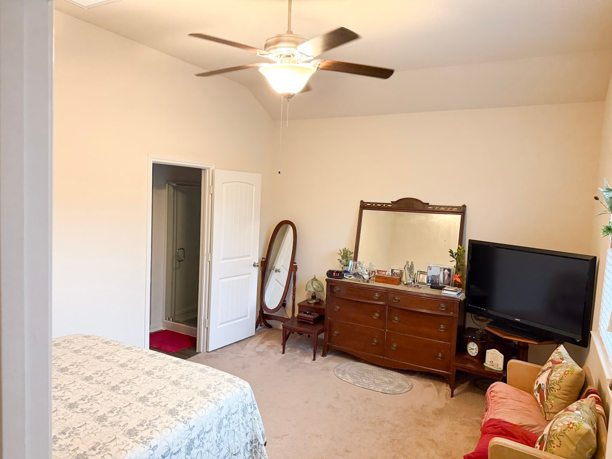 13979 Katlin Road Conroe, TX 77306 - Photo 9 of 13 a bedroom with a bed and a flat screen tv