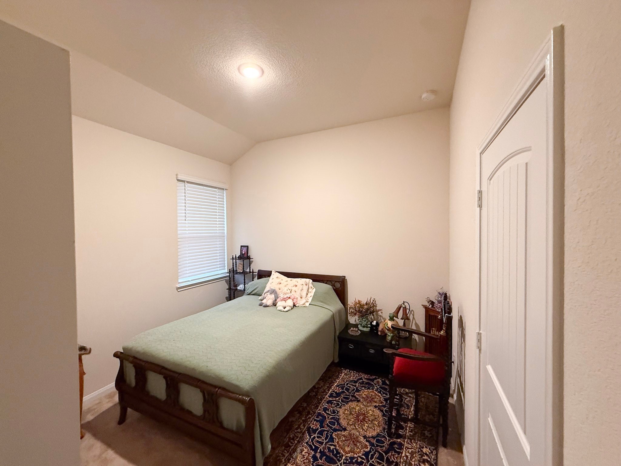 13979 Katlin Road Conroe, TX 77306 - Photo 10 of 13 a bed room with a bed and a tv