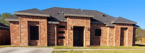 a front view of a house with glass windows