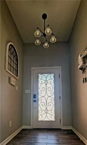 a view of an entryway with wooden floor