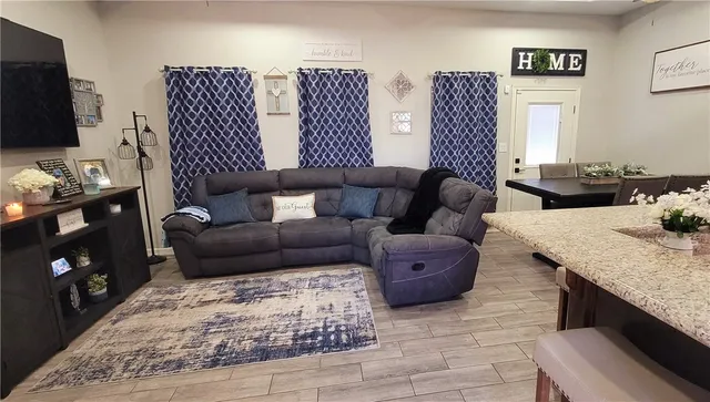 a living room with furniture and a couch