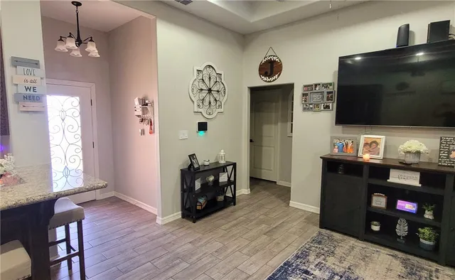 a living room with window and a flat screen tv