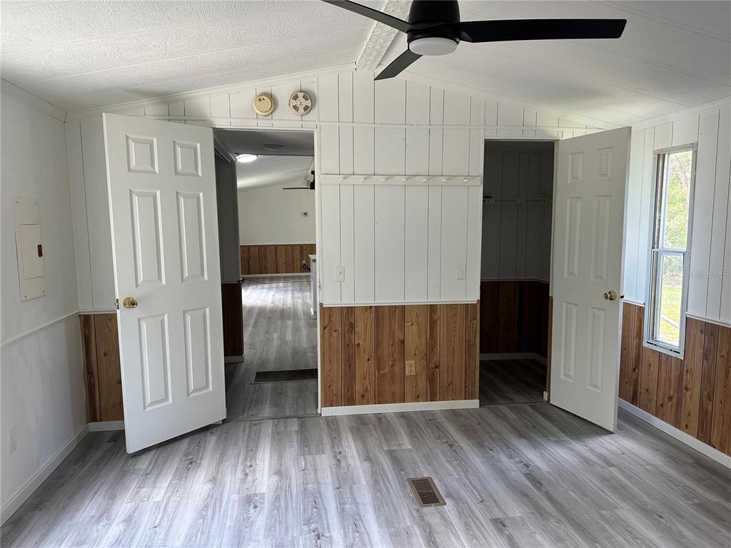 237 North Candle Point Crystal River, FL 34429 - Photo 12 of 21 an empty room with wooden floor and windows