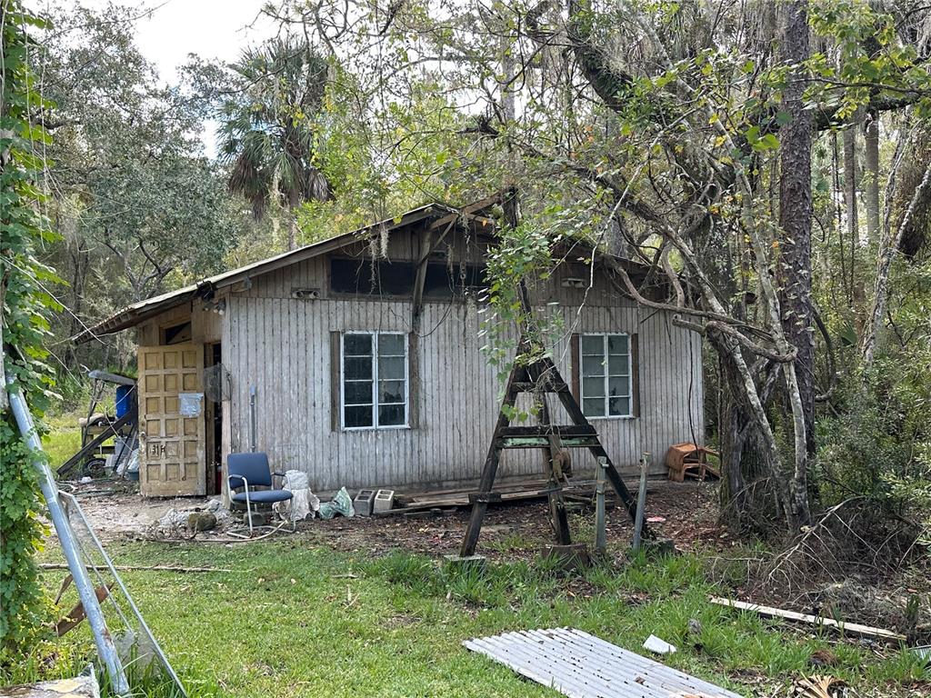 237 North Candle Point Crystal River, FL 34429 - Photo 17 of 21 a view of a house with backyard