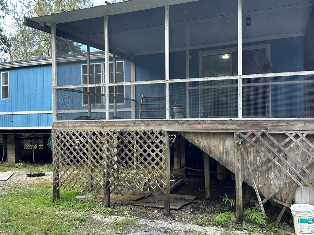237 North Candle Point Crystal River, FL 34429 - Photo 19 of 21 a black and white building with a porch