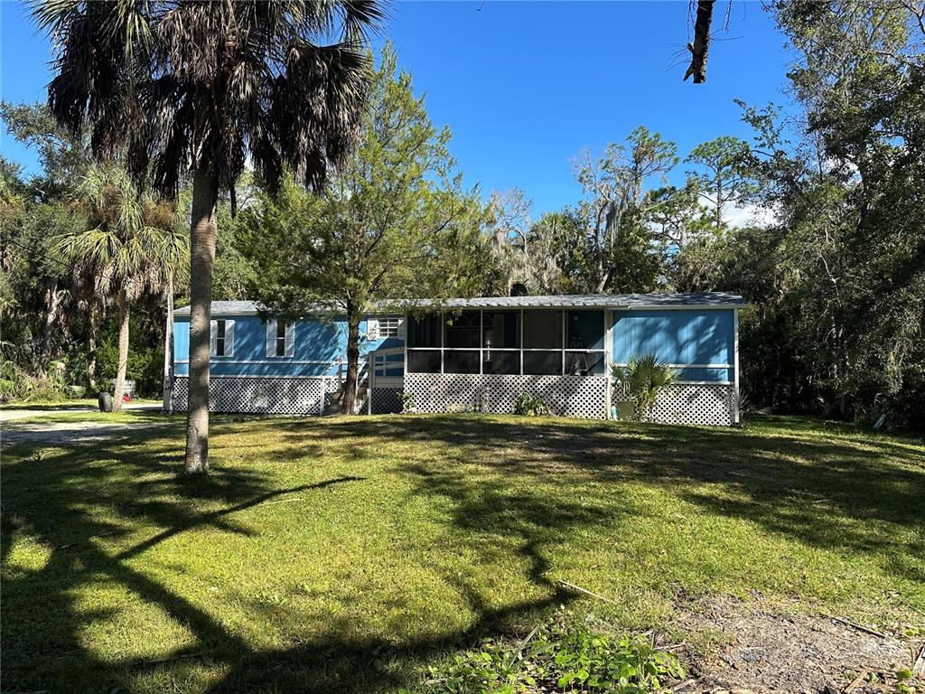 237 North Candle Point Crystal River, FL 34429 - Photo 3 of 21 a front view of a house with a yard
