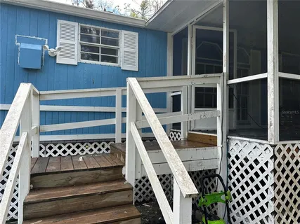 a view of outdoor space with deck and yard