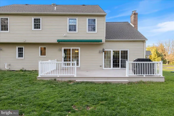 a front view of a house with a deck
