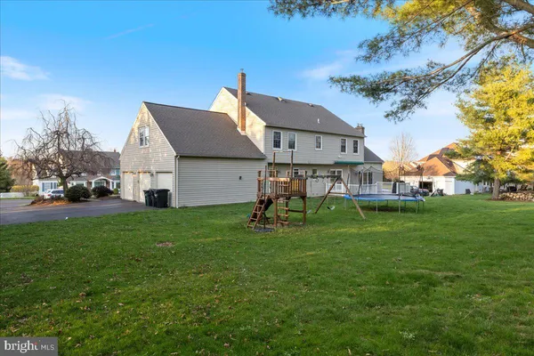 a aerial view of a house with a yard porch and sitting area