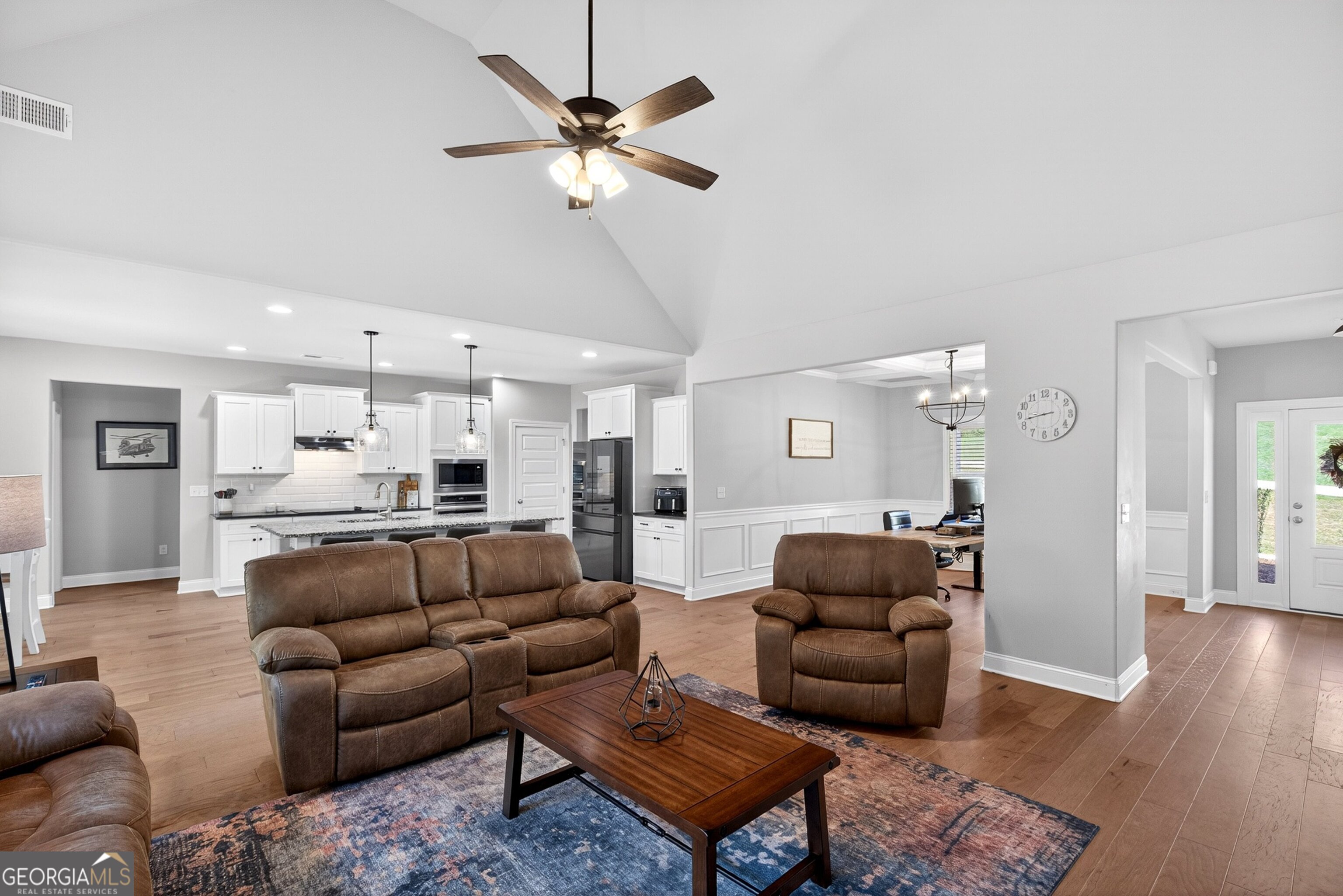 1764 Luther Bailey Road Senoia, GA 30276 - Photo 16 of 63 a living room with furniture and a wooden floor