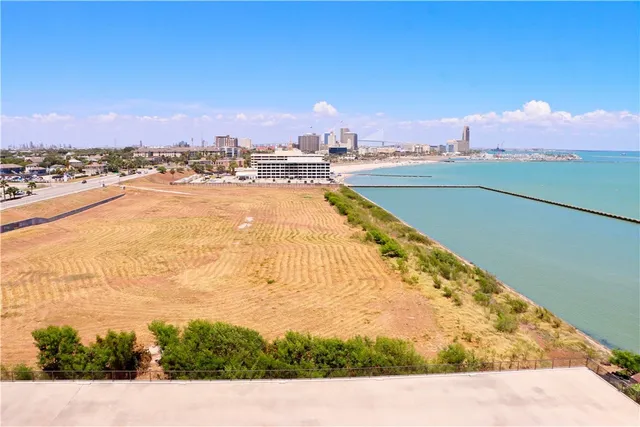a view of a swimming pool and an outdoor seating